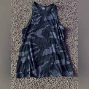 Nice tank top. Wash tag was cut off. Good material. Not cropped.